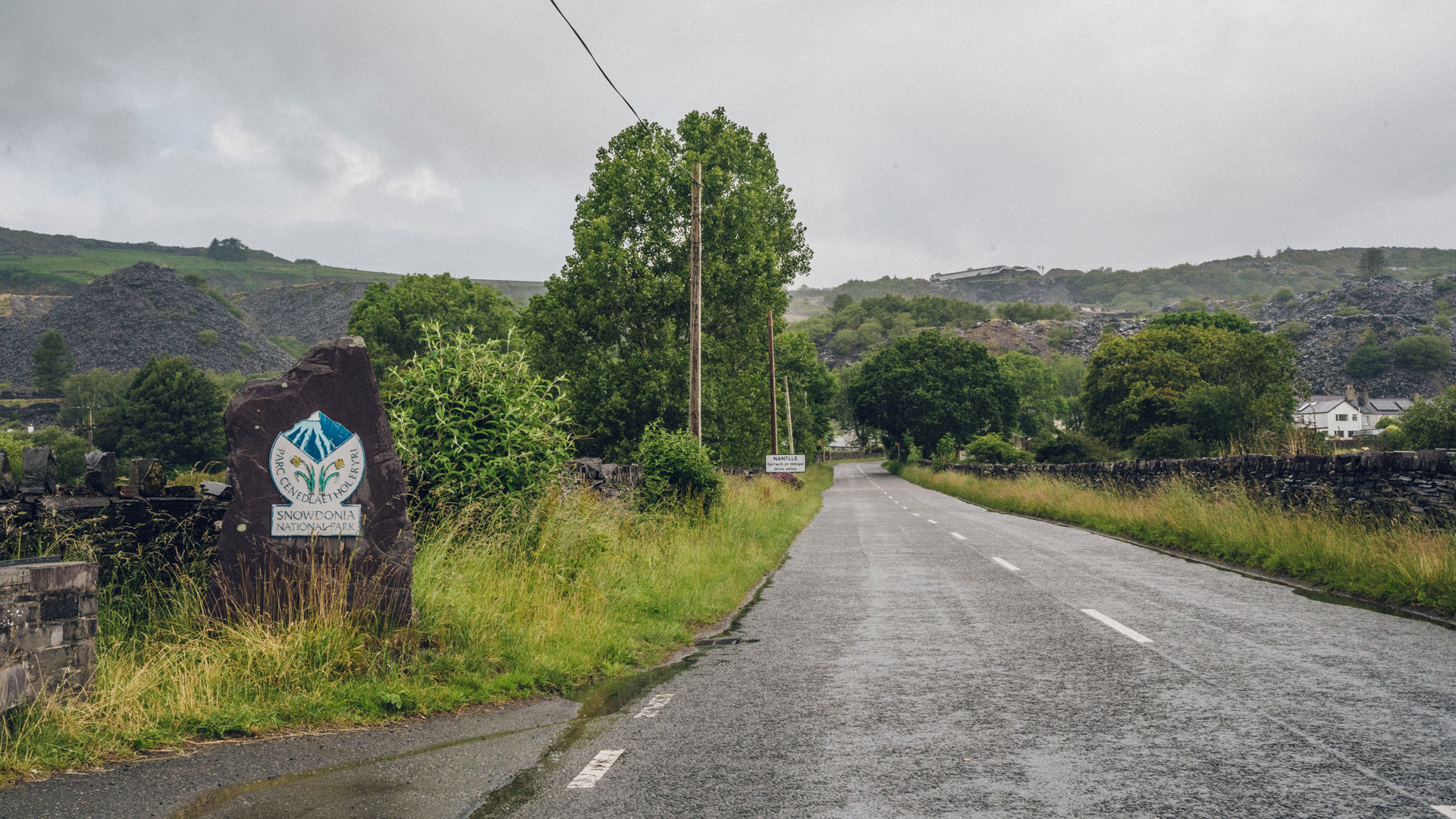 The road to Nantlle with the Eryri National Park signpost