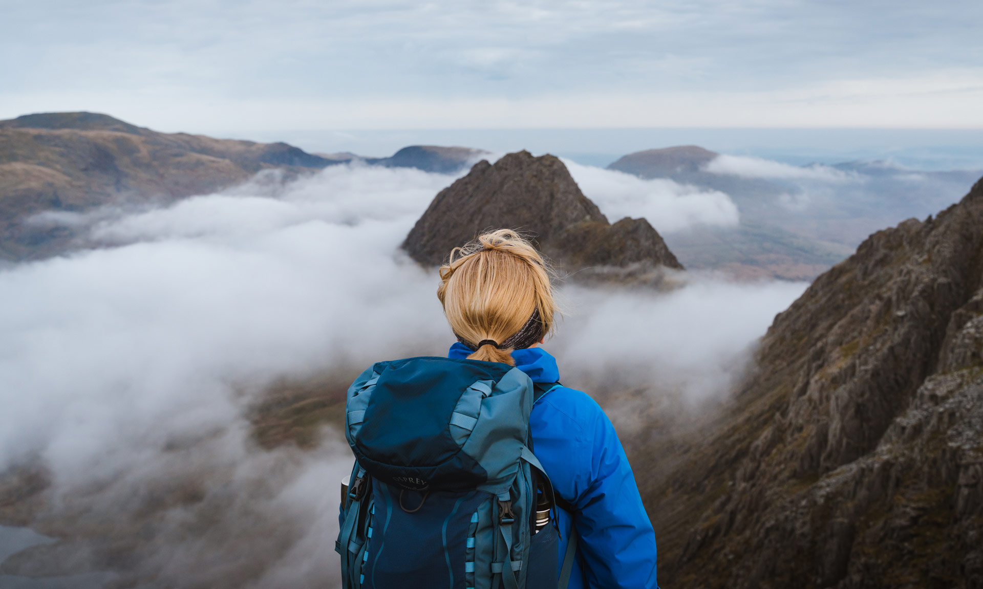 A hiker overlooks the Glyderau