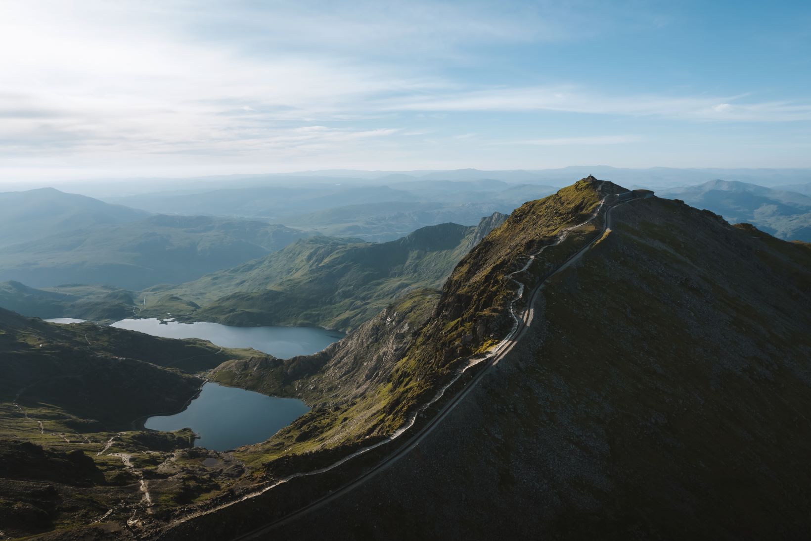 Drone photo of the Llanberis Path leading to the summit of Yr Wyddfa ond a bright spring day.