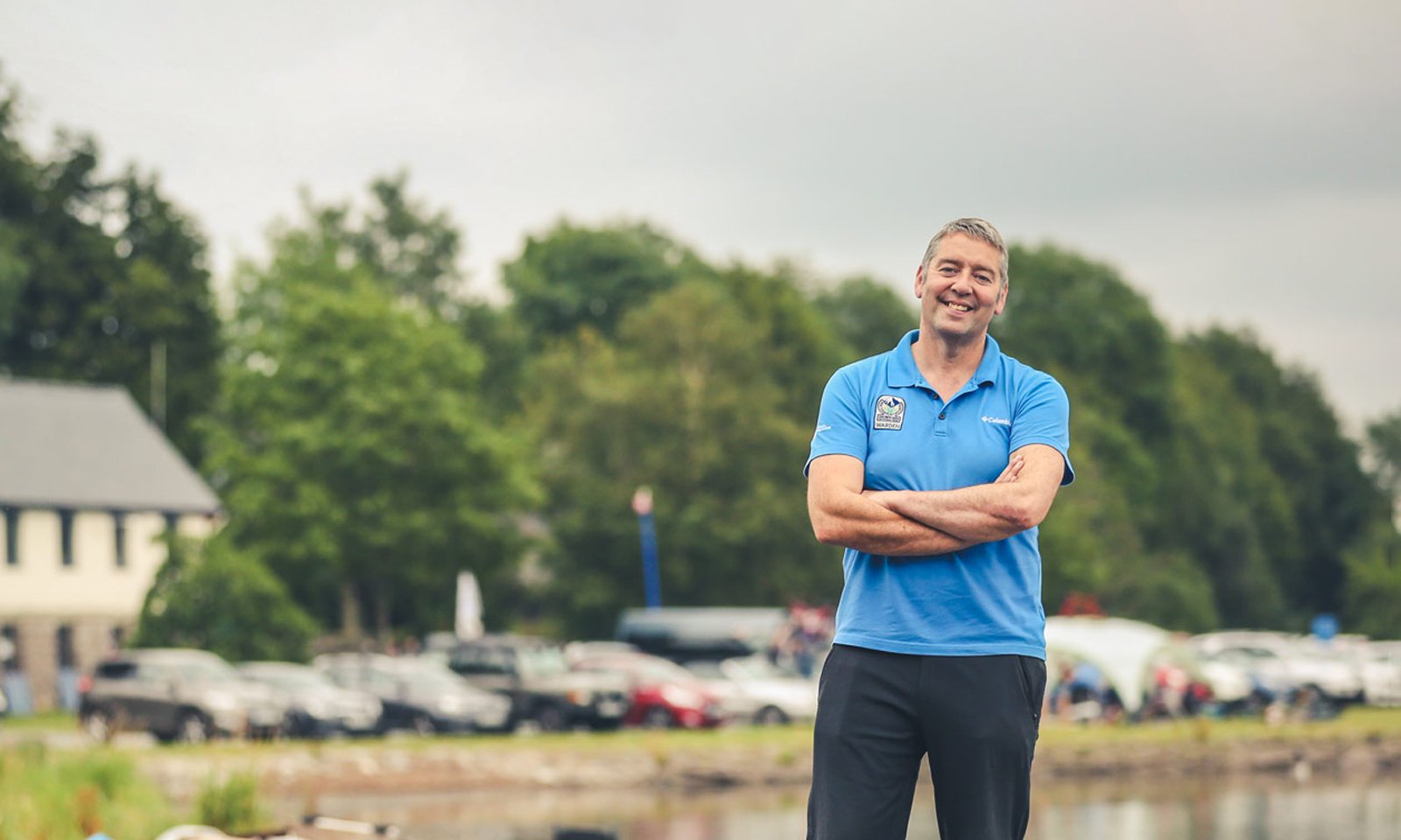 Eryri National Park warden standing near Llyn Tegid